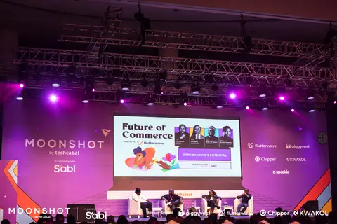 The main stage lit in purple during the Future of Commerce session.