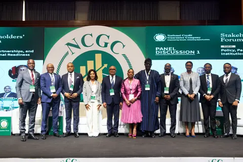 Panellists and guests line up on stage for the official photograph at the NCGC forum.